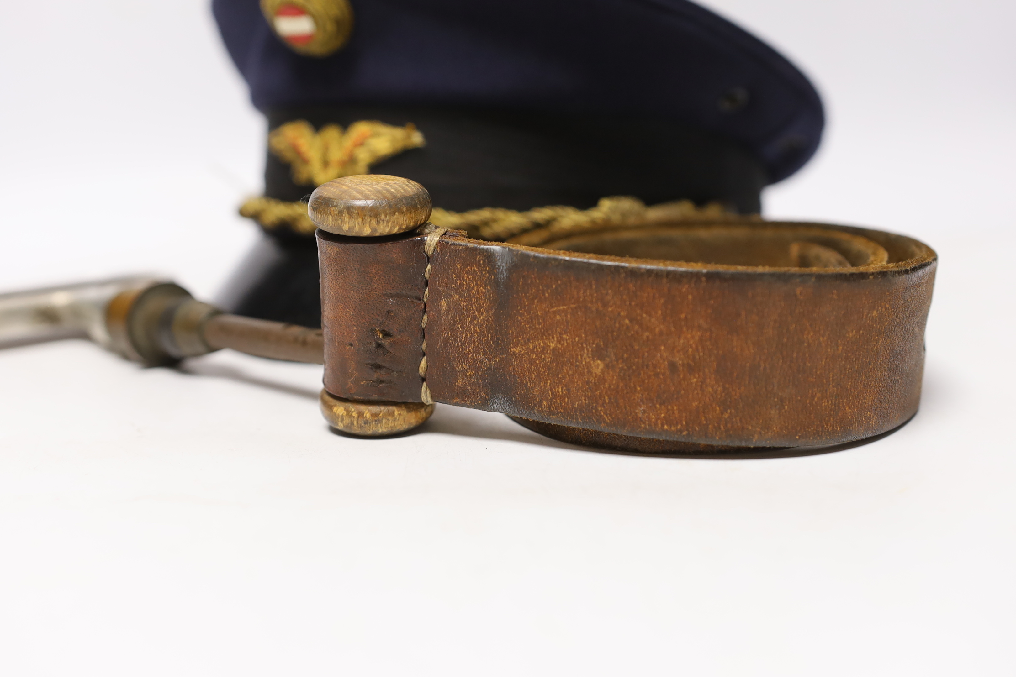 A post WWII Austrian National Railway Guard's hat and original window leather strap and emergency pull (3)